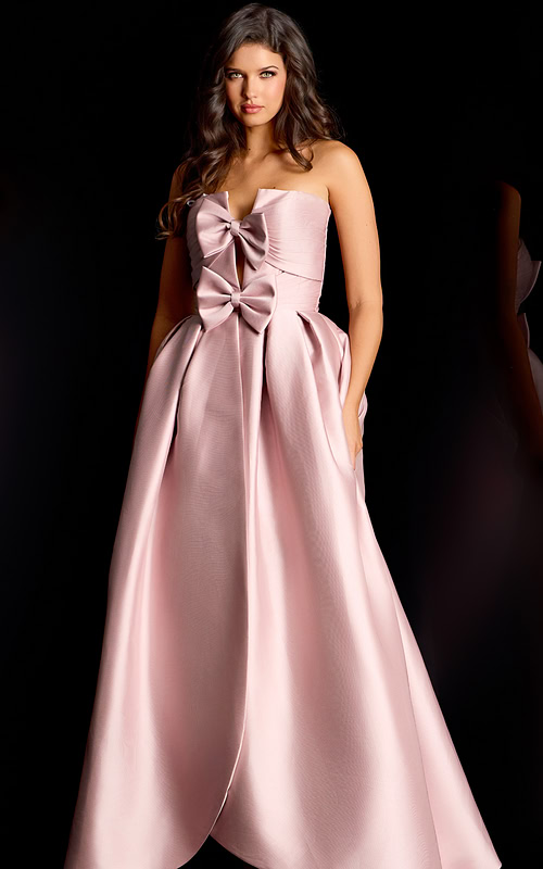 Glamorous strapless formal gown with oversized bow accents and voluminous silhouette