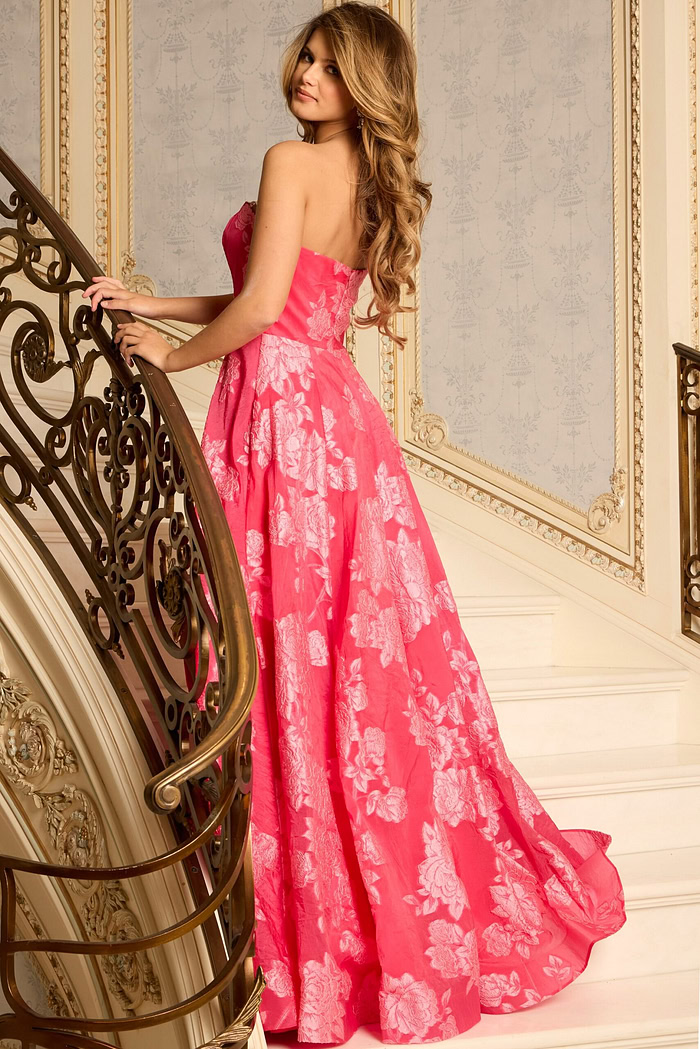 Back View Of Embroidered Strapless Gown With Flowing Skirt