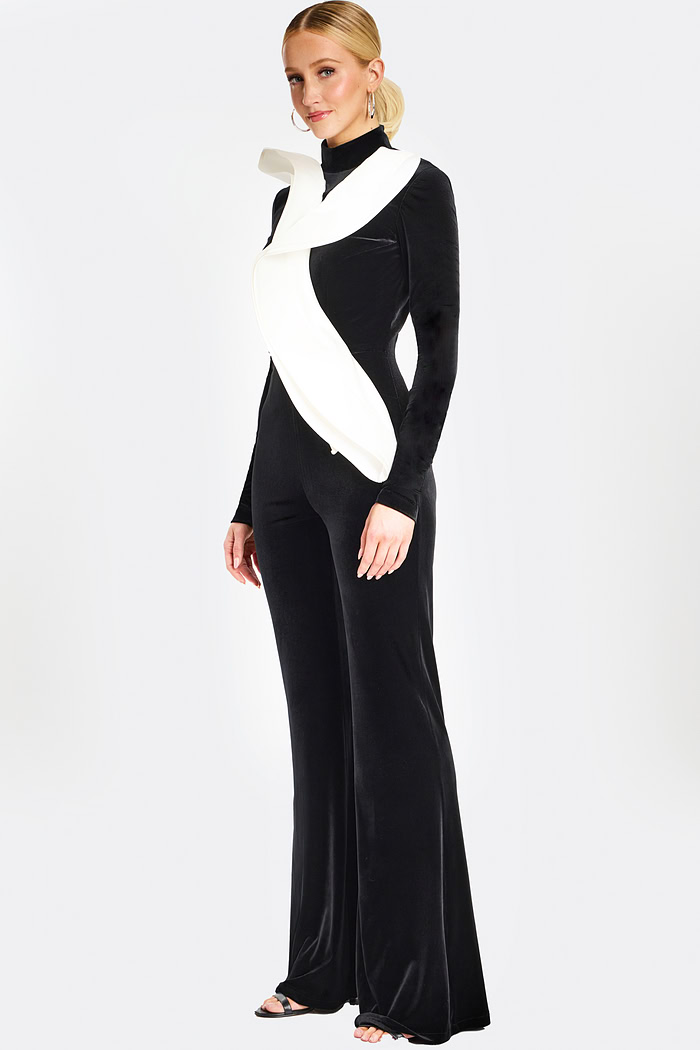 Three-quarter rear angle of black jumpsuit highlighting tailored fit