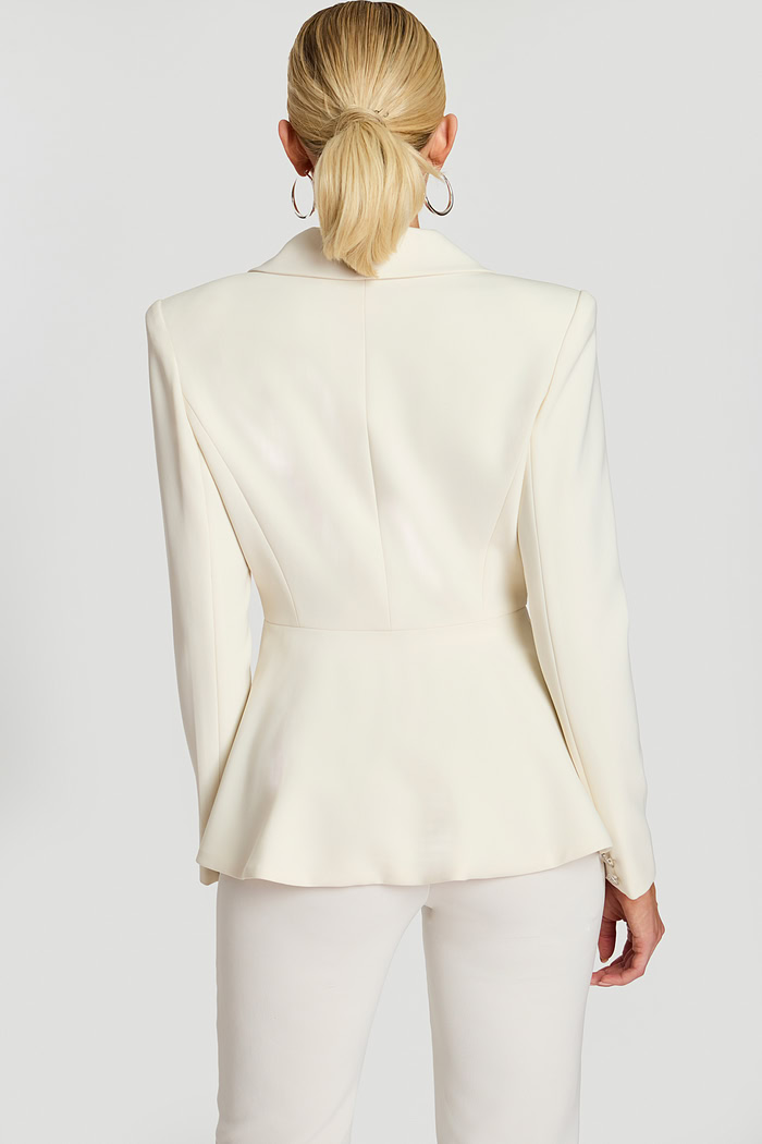 Back view of off-white blazer with fitted waist and soft flared hem