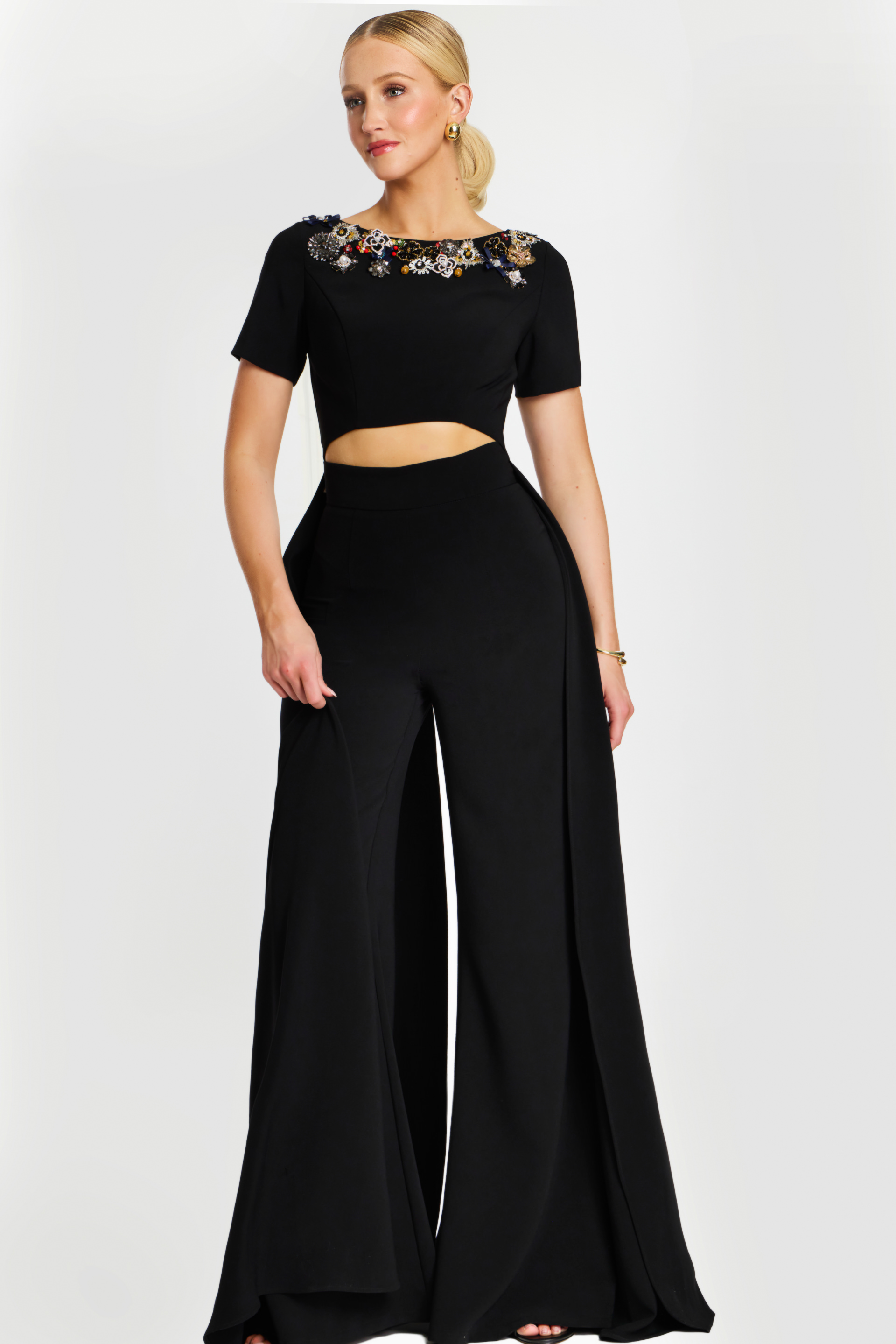 Elegant wide-leg black jumpsuit with embellished neckline and side panels