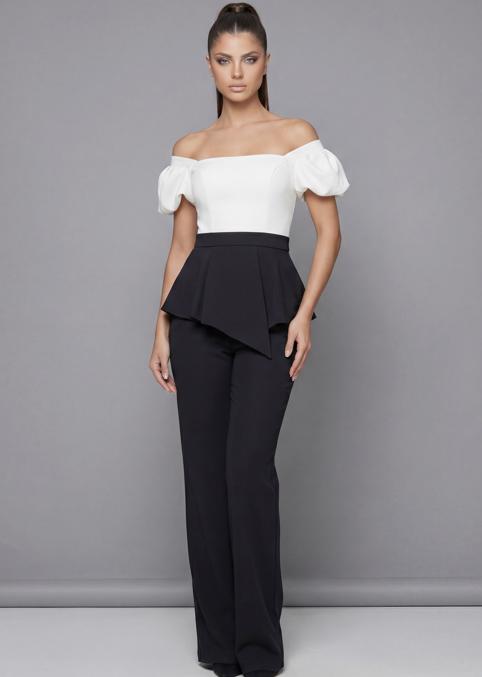 Black designer pants outfit with sculpted peplum waist