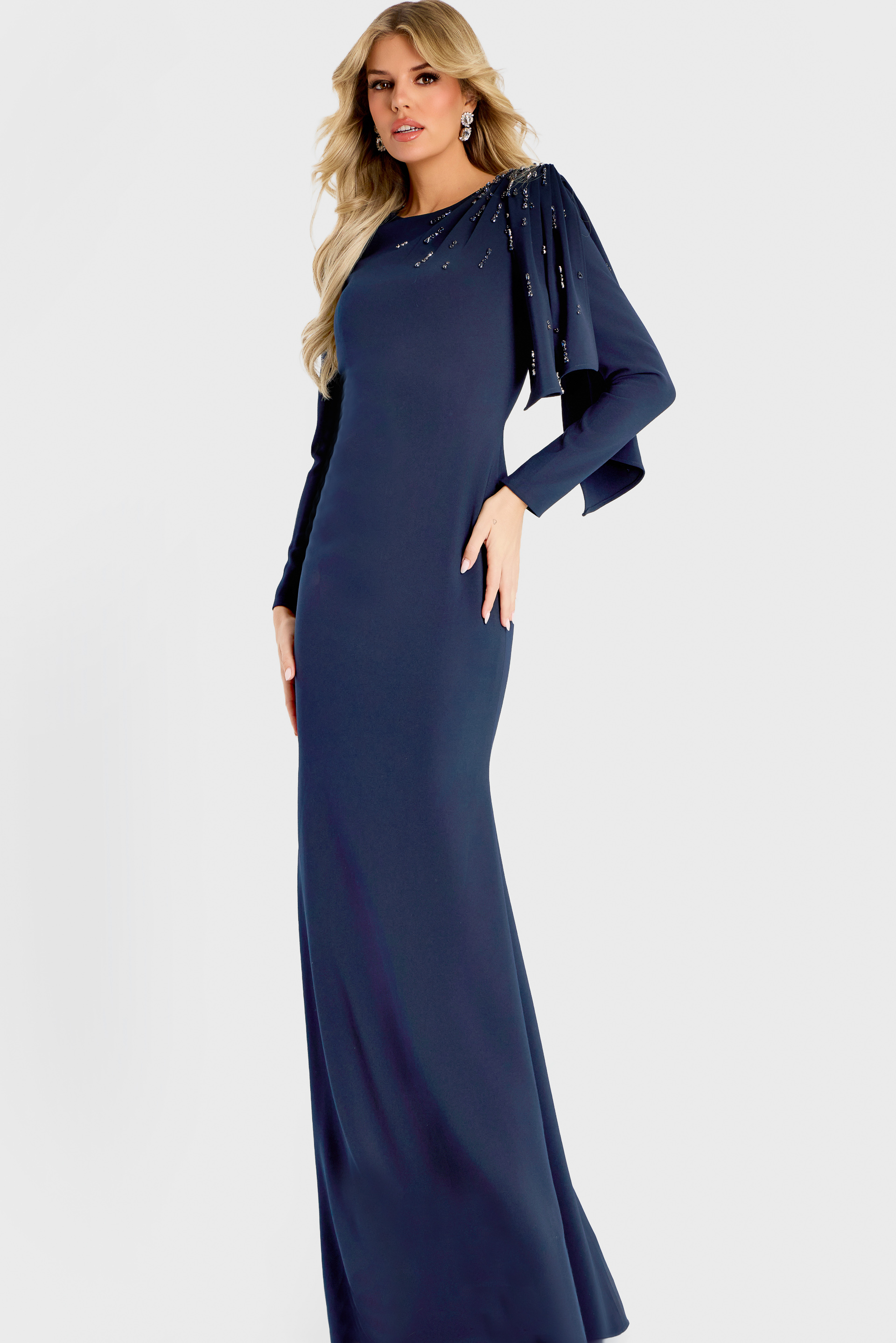 Elegant navy gown with long sleeves and embellished shoulder drape