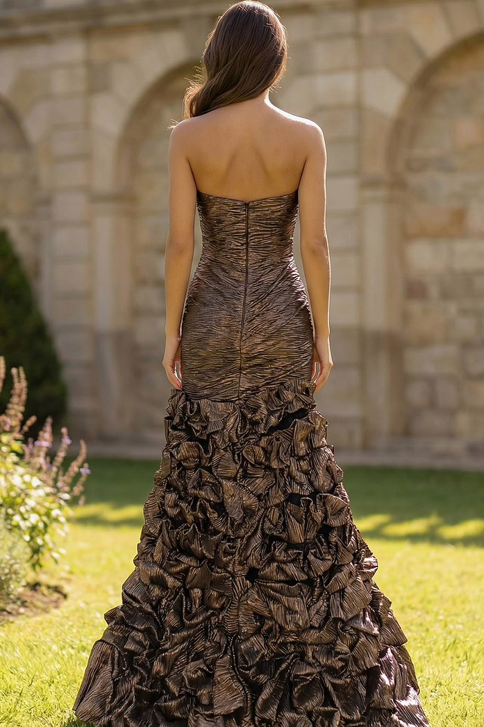 Elegant strapless gown with sculpted bodice and dramatic hem detail
