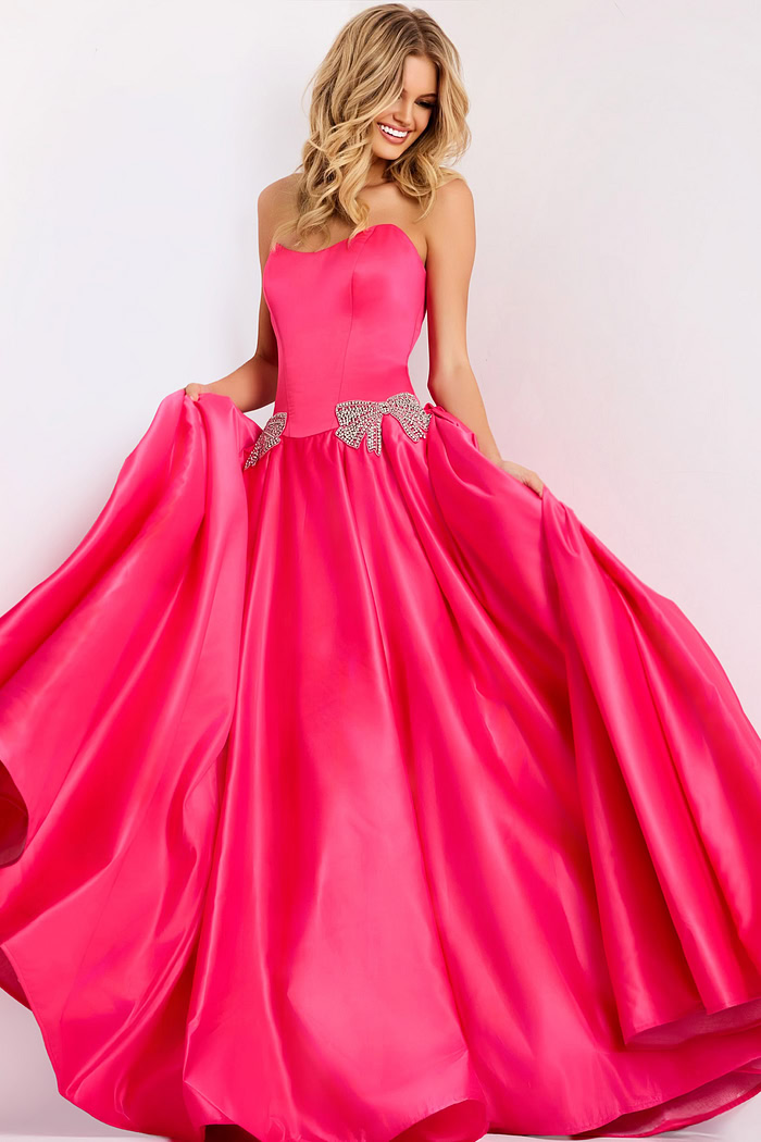 Hot pink strapless ball gown with crystal bow accents