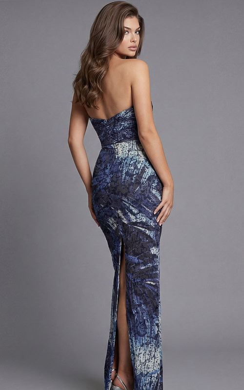 Back view of a strapless floor length gown with a center back slit and fitted silhouette