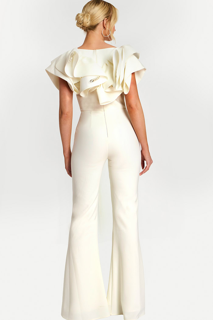 Back view of fitted white jumpsuit with voluminous shoulder ruffles
