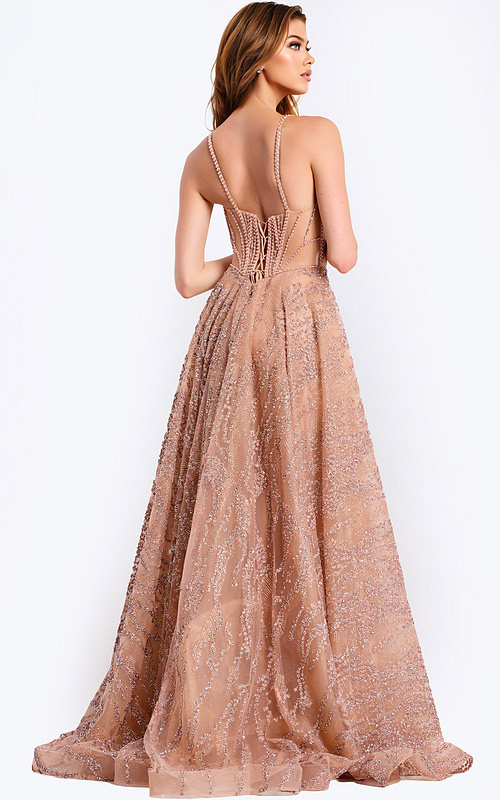 Nude tulle prom gown with shimmering beaded embellishments