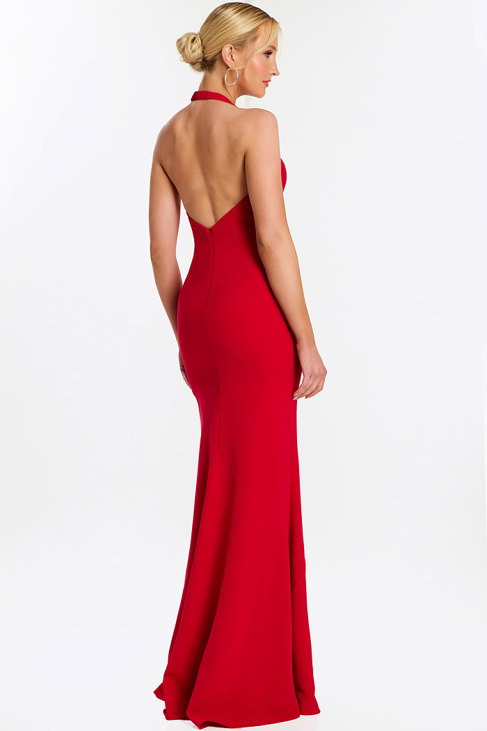 Rear side angle of red halter gown with soft train and fitted waist