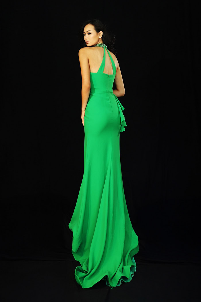 Green halter prom dress with beaded neckline and side ruffle detail