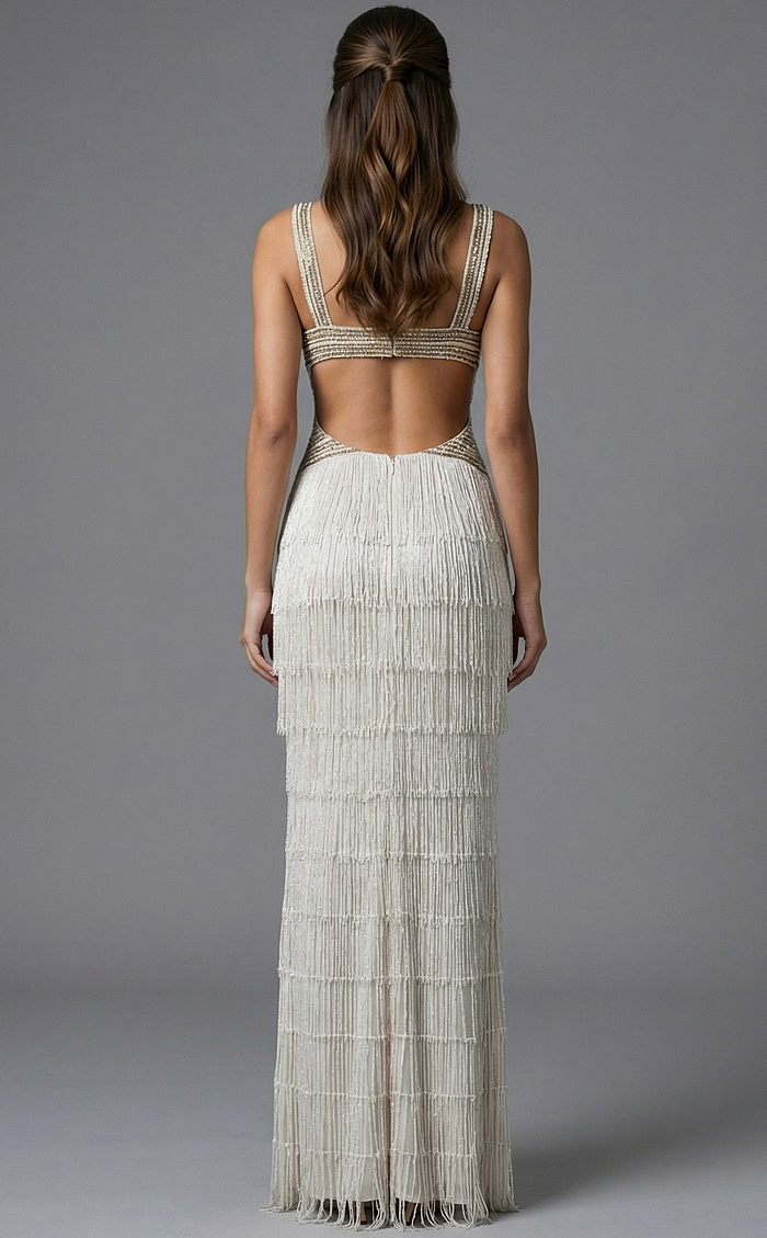 Fitted formal gown featuring intricate beadwork and high slit design