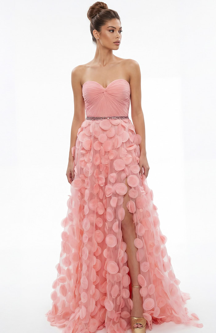 Front view of strapless gown with sweetheart neckline, gathered bodice, and textured appliqué skirt with front slit