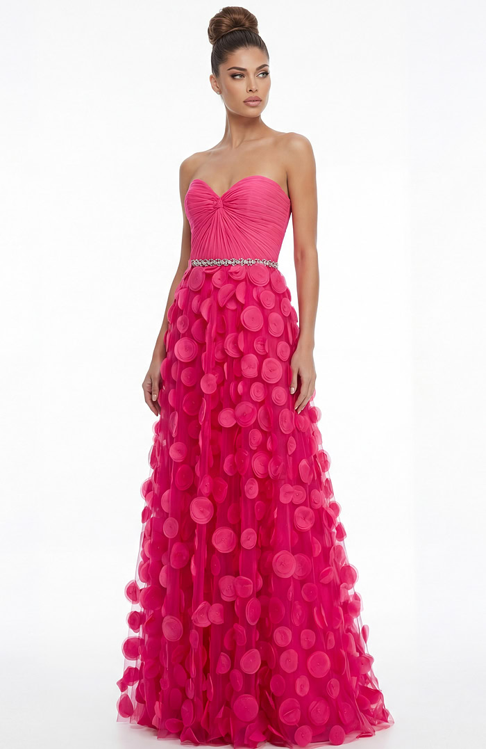 Straight on view of strapless evening gown with fitted bodice, embellished waistband, and layered appliqué tulle skirt