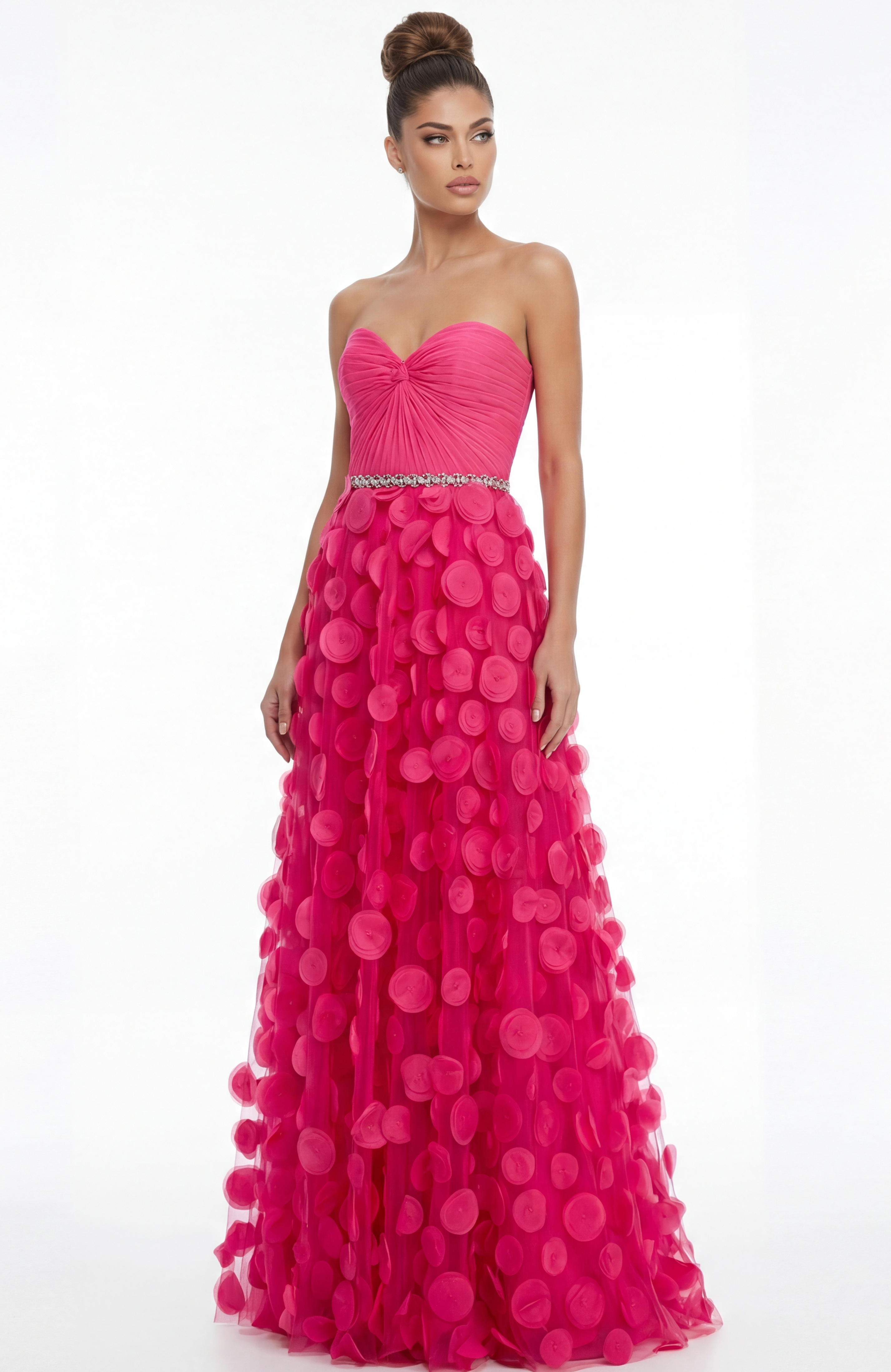 Straight on view of strapless evening gown with fitted bodice, embellished waistband, and layered appliqué tulle skirt