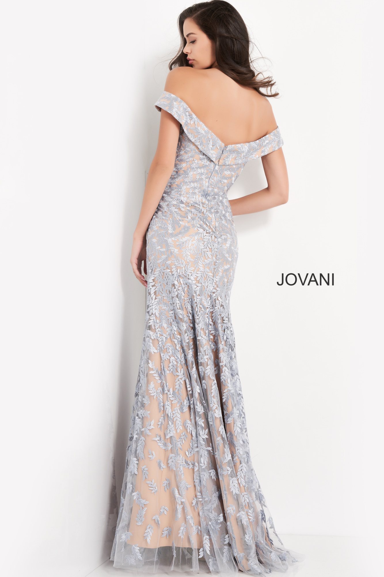 Model wearing Jovani 49634 light blue lace dress, back view.