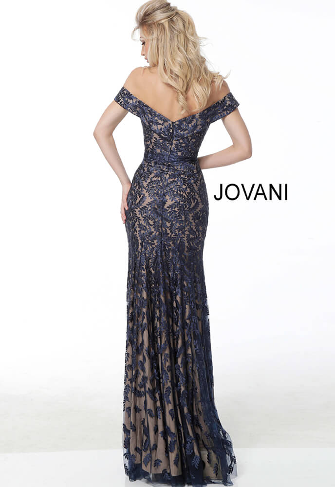 Model wearing Jovani 49634 navy lace dress, back view with open back.