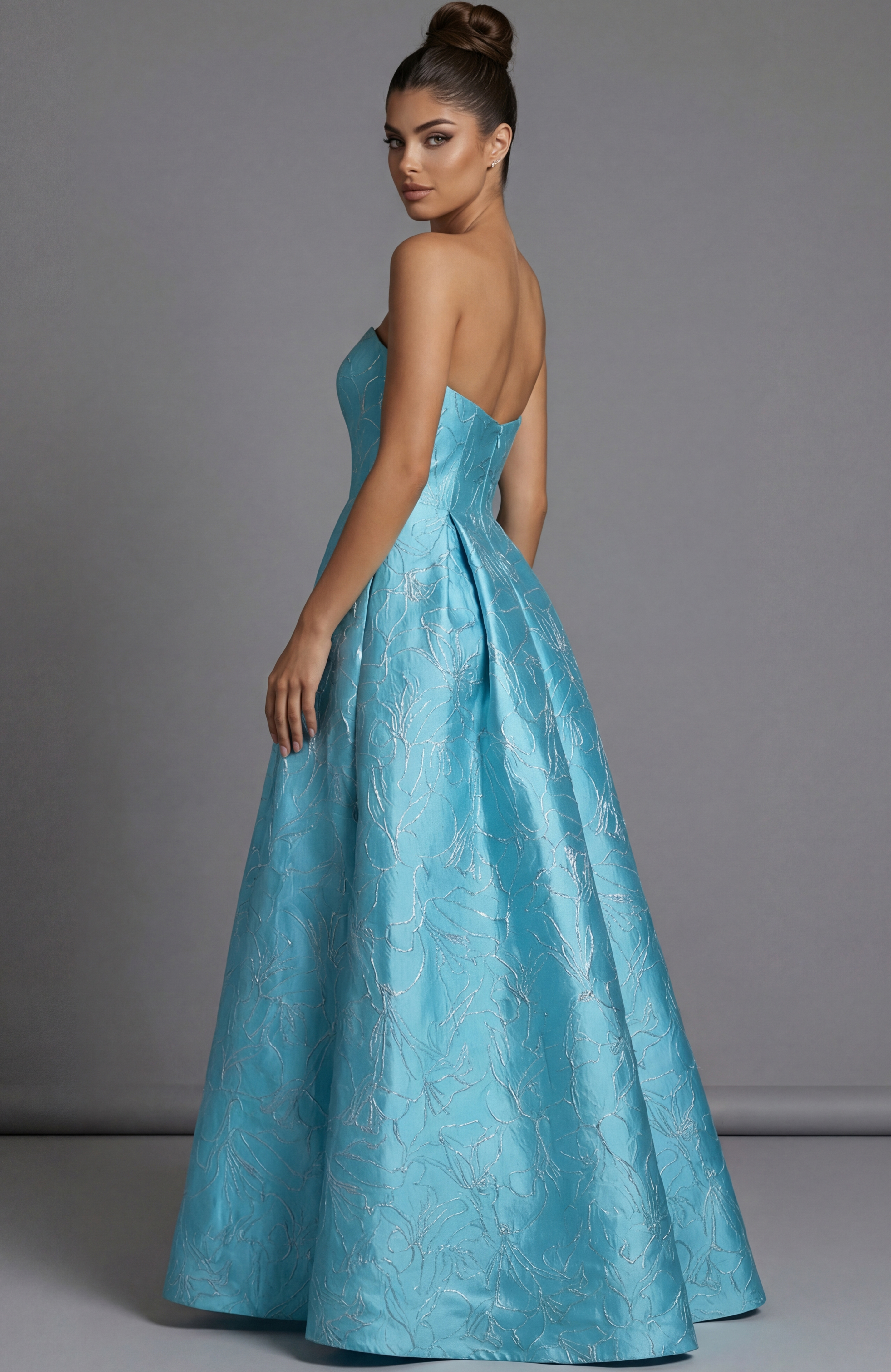 Strapless high low brocade dress with structured bodice and flowing back skirt