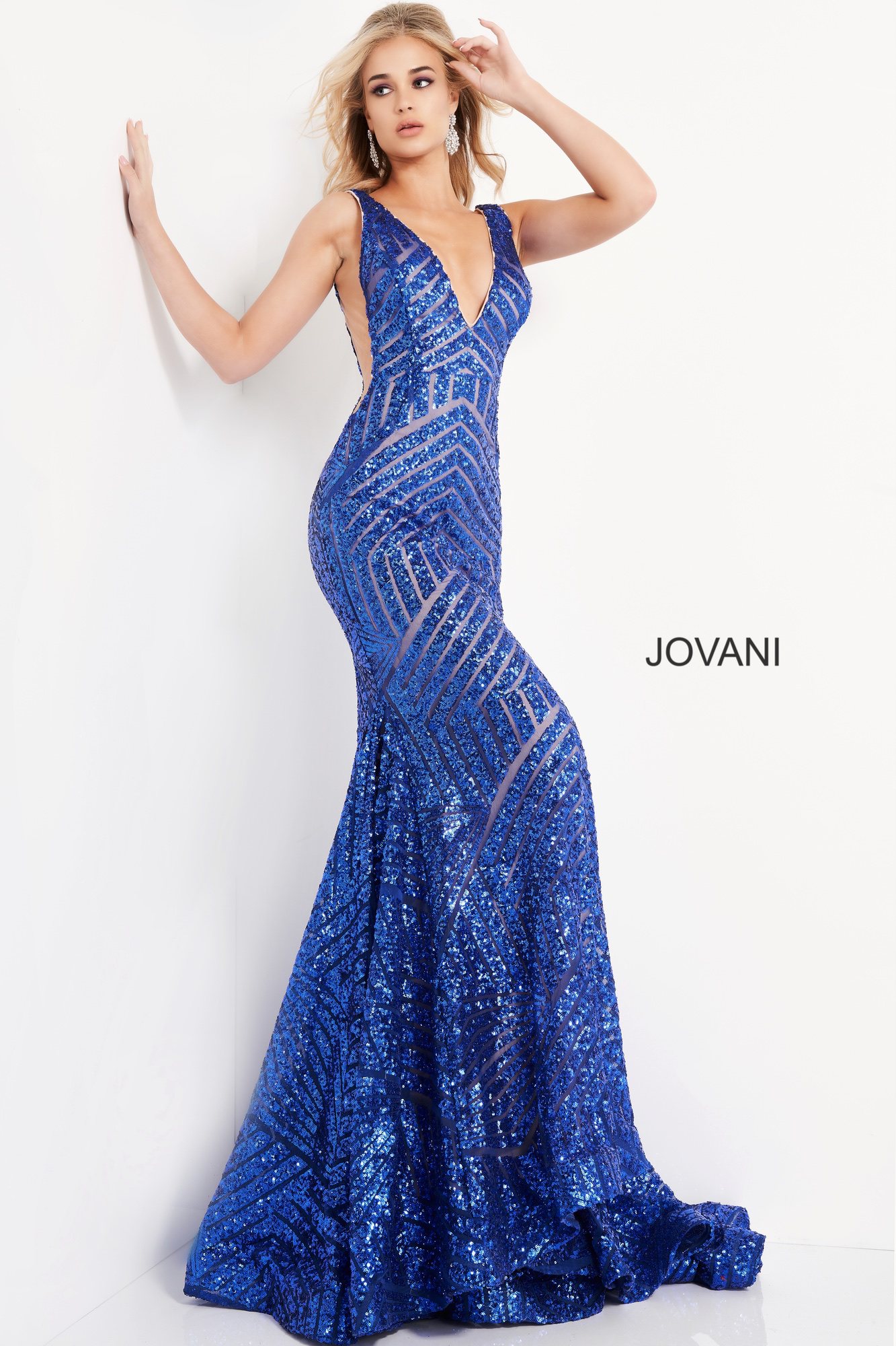 Model wearing Jovani 59762 royal blue gown with a plunging neckline and sequin detail.