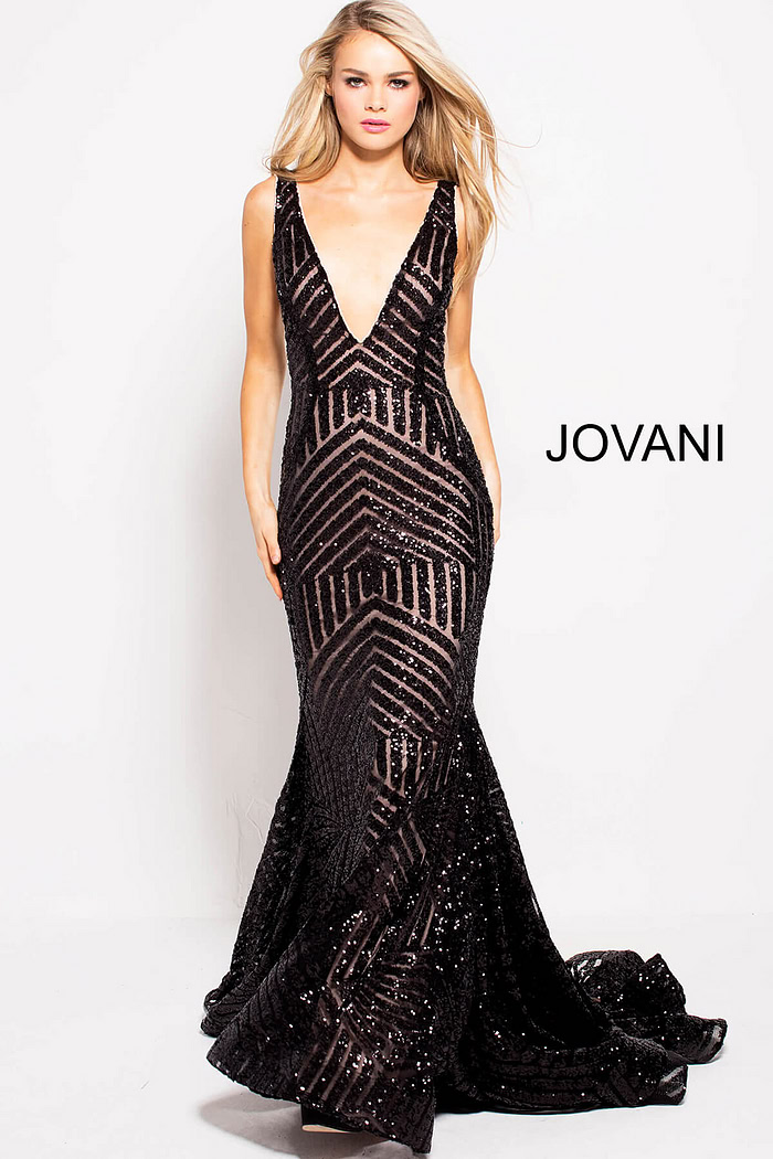 Model in Jovani 59762 black gown with striking sequin embellishments.
