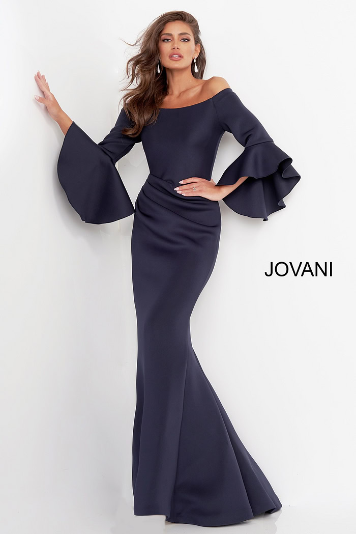 Model wearing Jovani 59993 Navy gown with elegant bell sleeves.