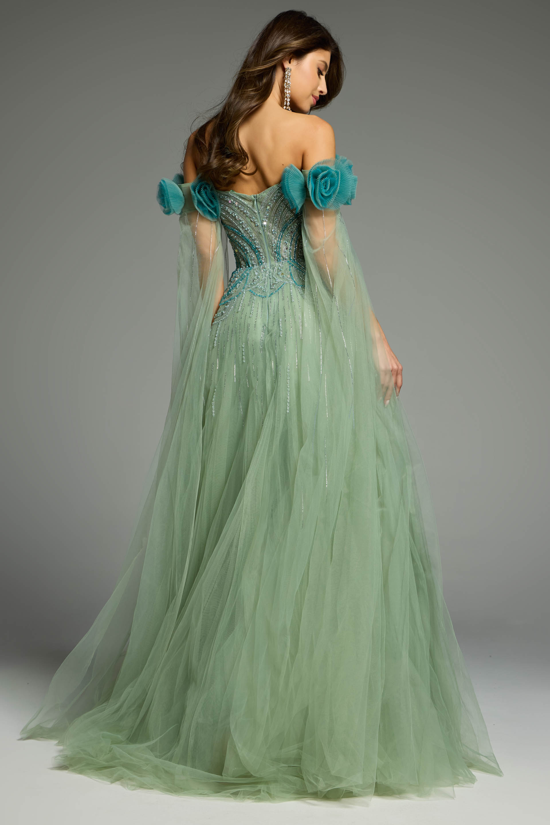 Back view of a green tulle dress showcasing layered elegance
