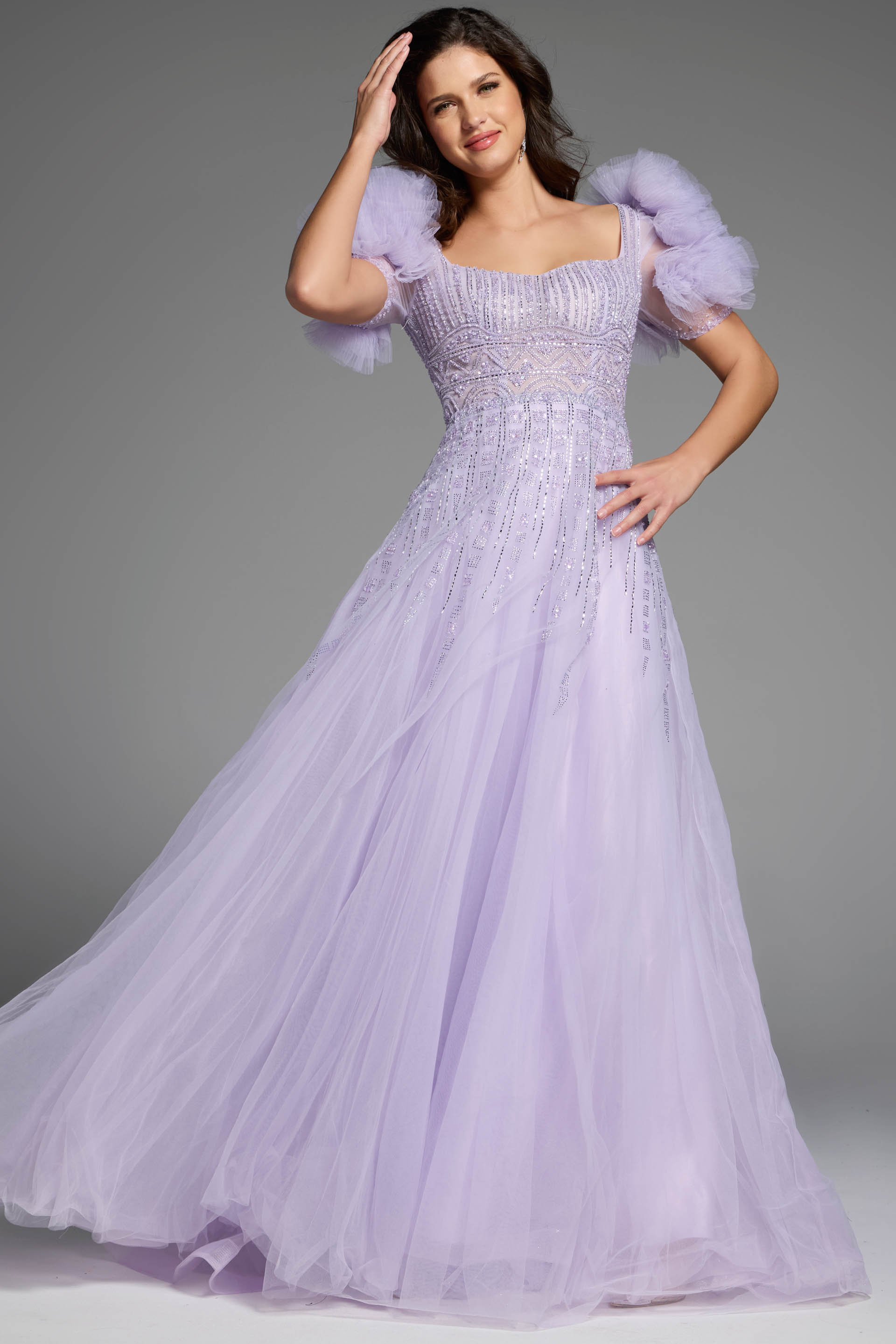 Puffy sleeve lavender evening gown with intricate beading and flowing tulle skirt.