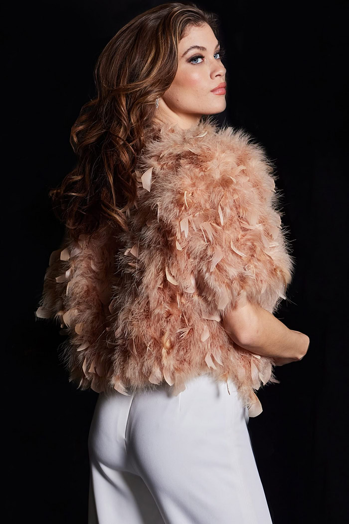Model in Jovani 62104 nude dress, back view highlighting feather details.