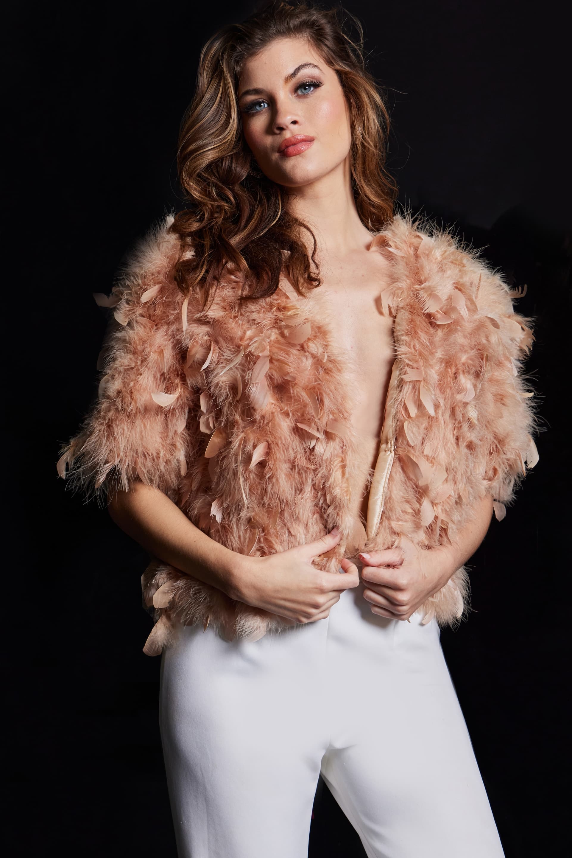 Front view of model wearing Jovani 62104 nude dress with feathered accents.