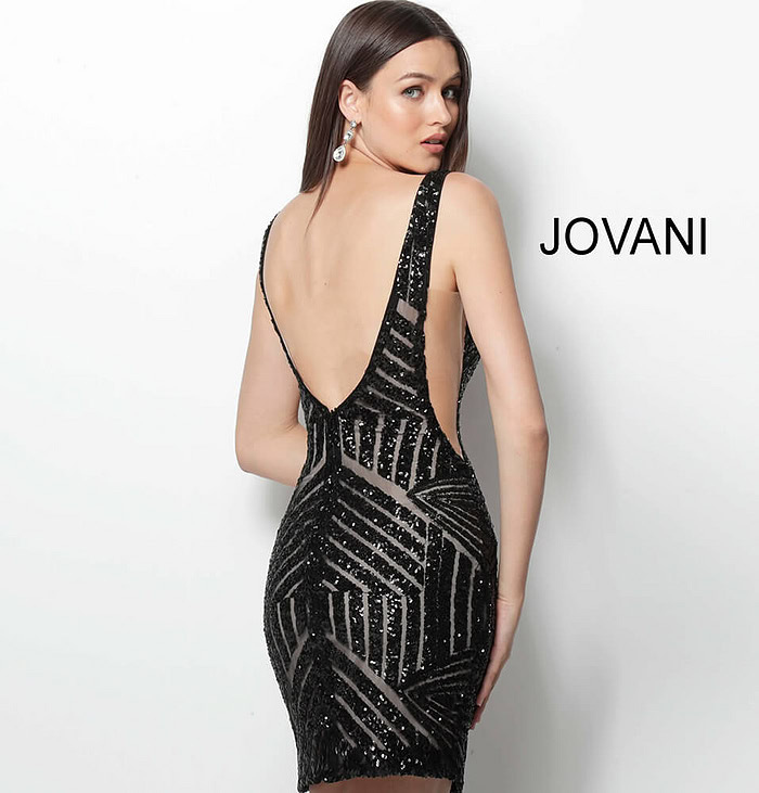Model wearing Jovani 63899 black sequin mini dress, back view.