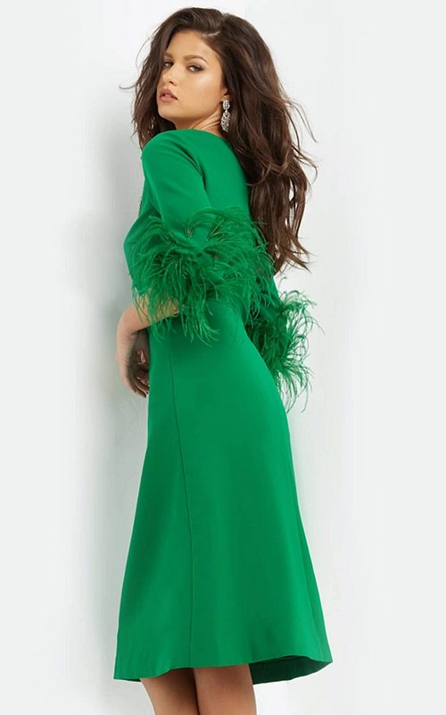 Model wearing Jovani 07341 green midi dress with feather-trimmed sleeves, back view.