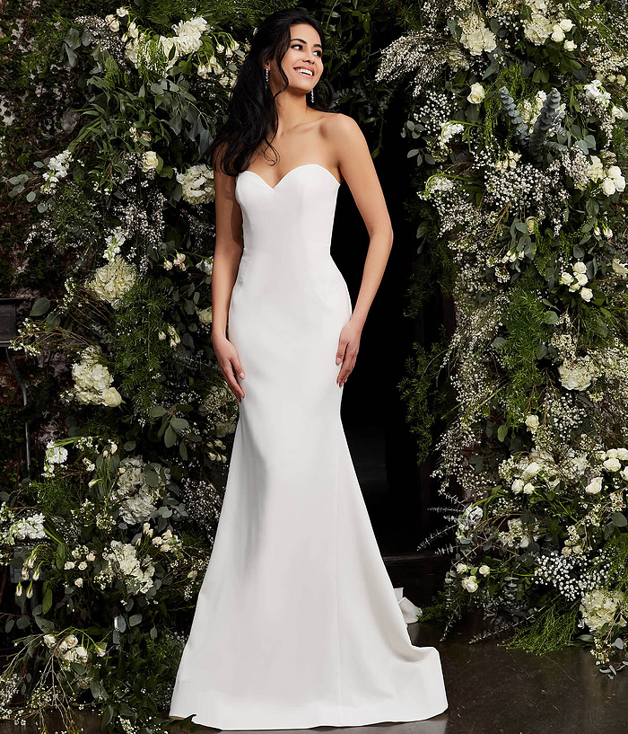 Front view of model wearing Jovani JB06912 ivory gown.
