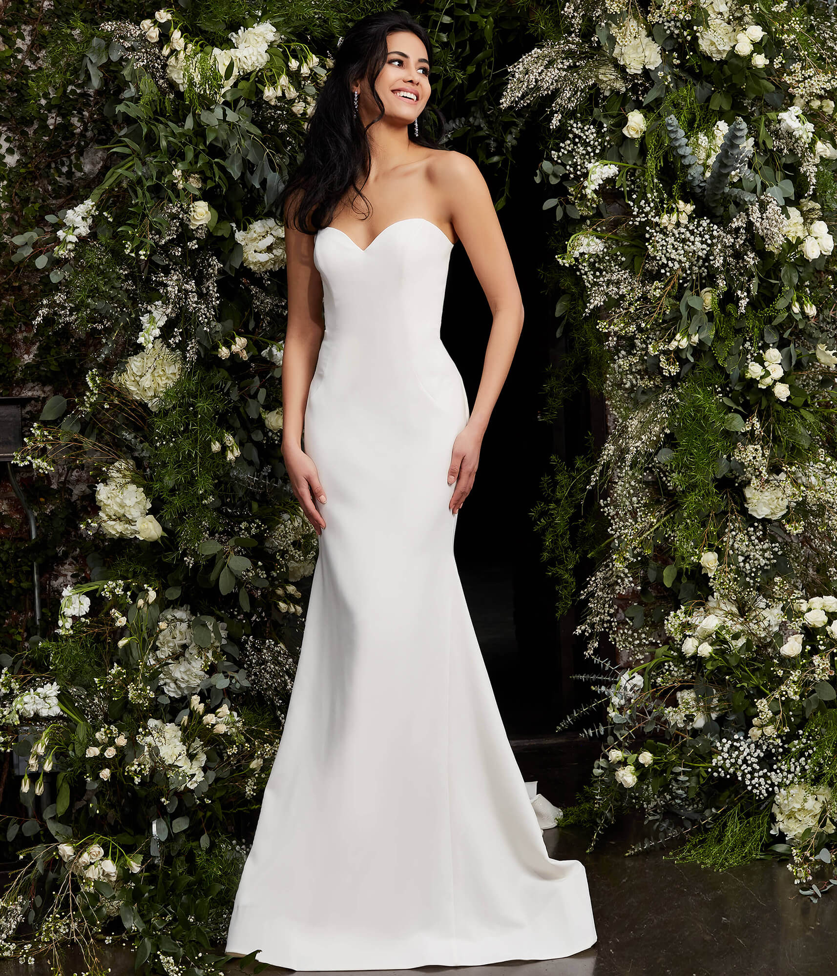 Front view of model wearing Jovani JB06912 ivory gown.