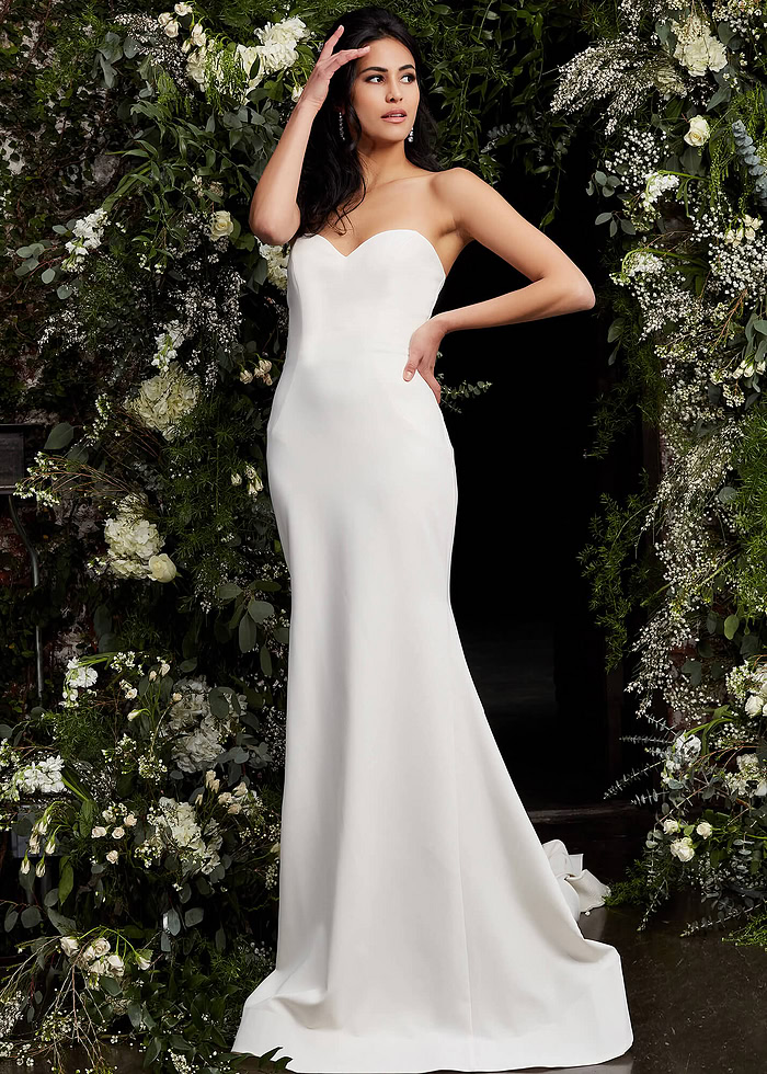 Jovani JB06912 ivory dress with sweetheart neckline, front view in floral setting.