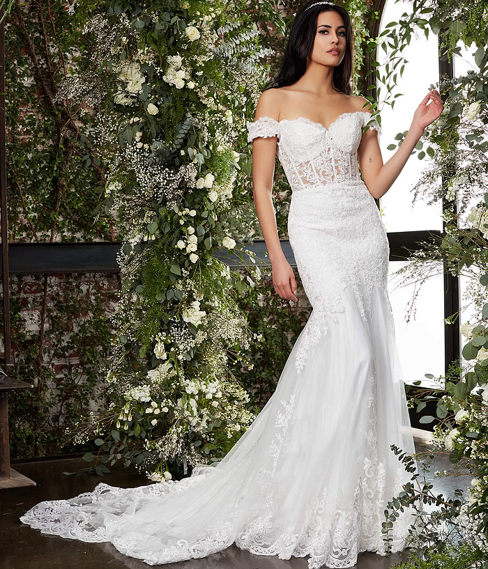 Model showcasing Jovani JB07161 in ivory with lace bodice