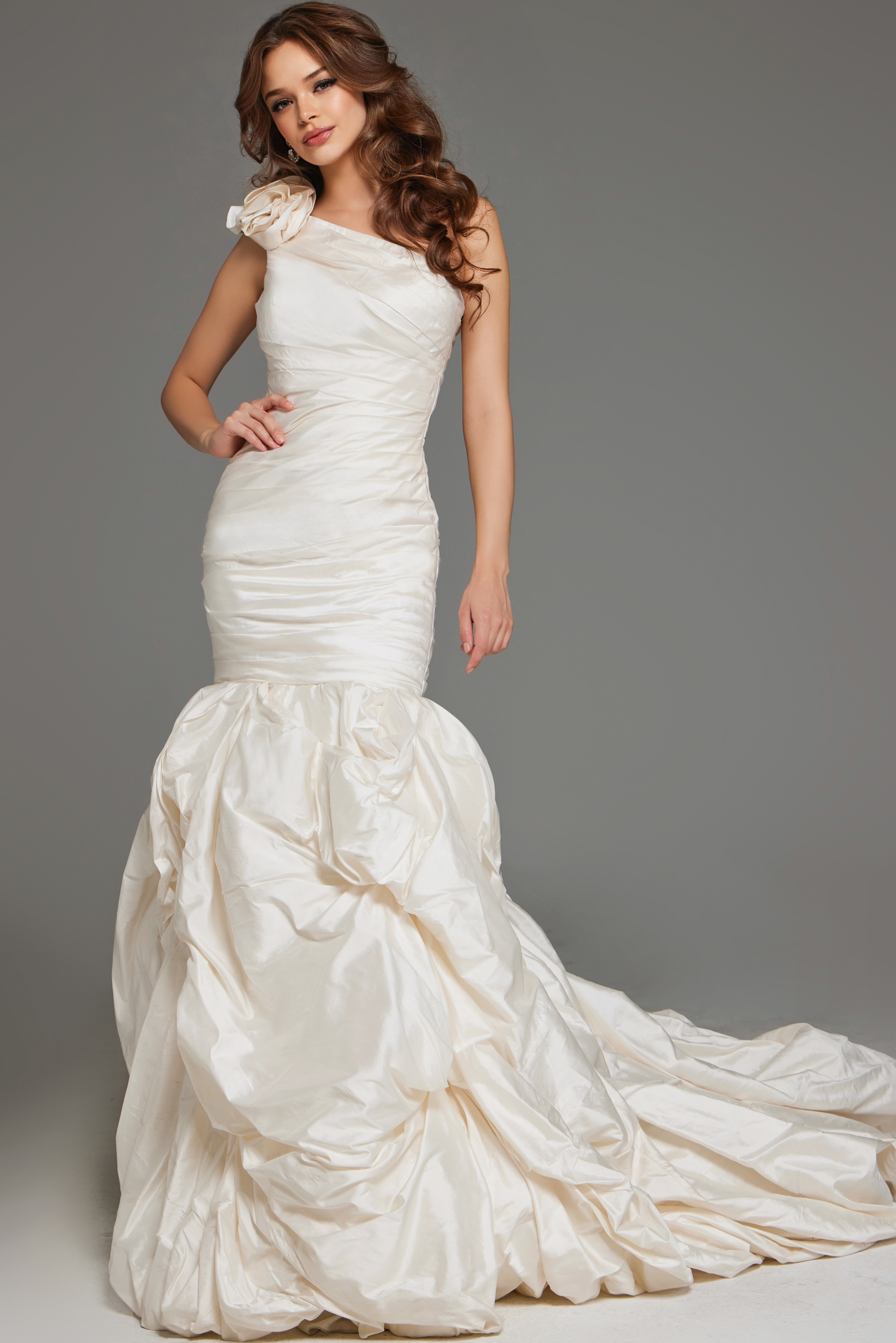Model wearing Jovani 07179 white gown with one-shoulder neckline and mermaid silhouette, front view.
