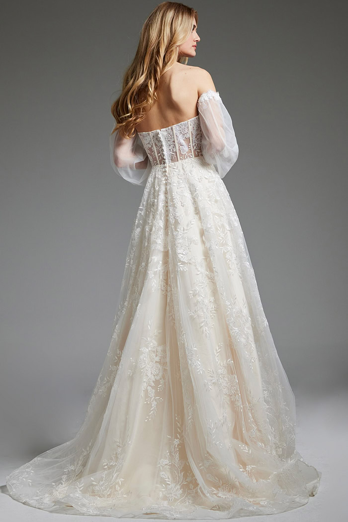 Model wearing Jovani JB220004 ivory gown with off-the-shoulder detail, front view.