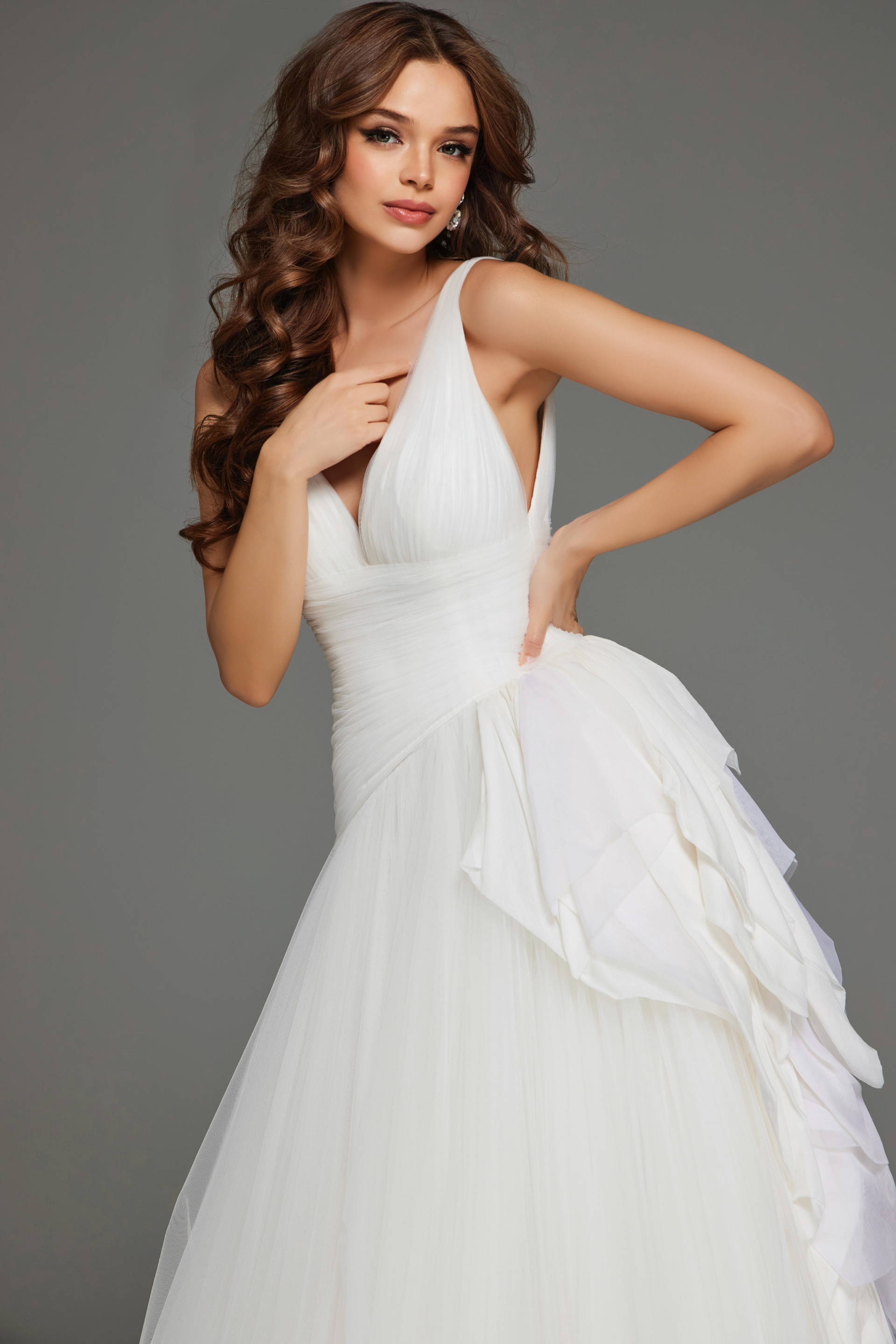 Close-up view of Jovani JB23241 white dress highlighting deep V-neck and ruffles.