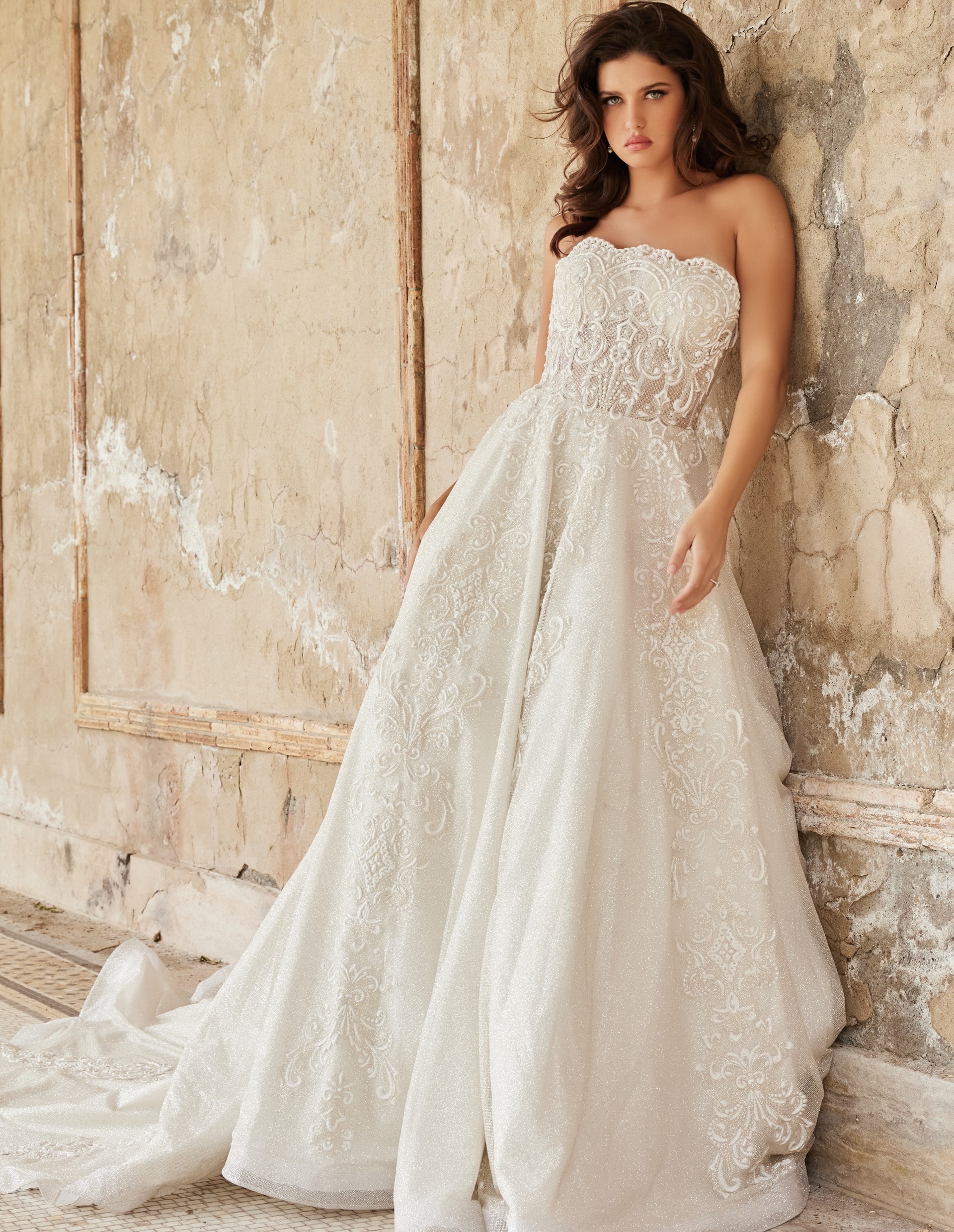 Jovani JB24563 wedding dress showing intricate lace details and elegant flow, front view.