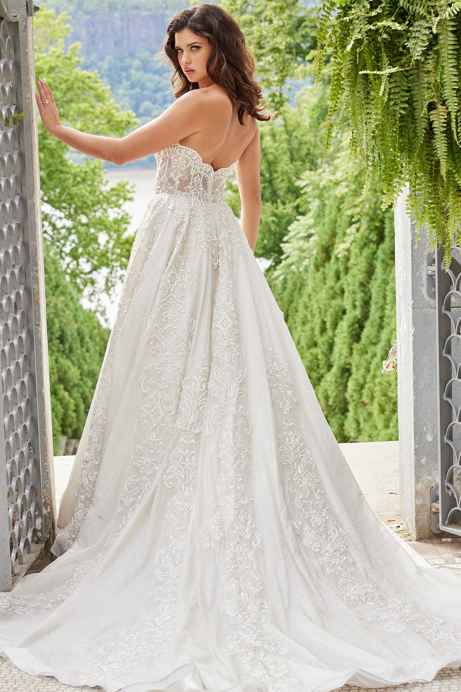 Back of Jovani JB24563 wedding dress featuring lace details and soft train.
