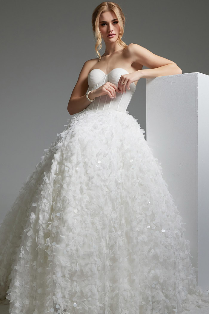 model wearing Jovani JB26295 A-line white dress detailed with floral appliqué