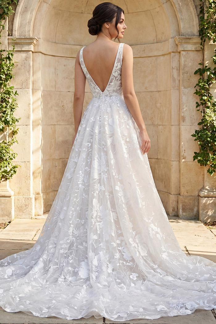 elegant floral lace bridal gown with v neck bodice and flowing a line skirt
