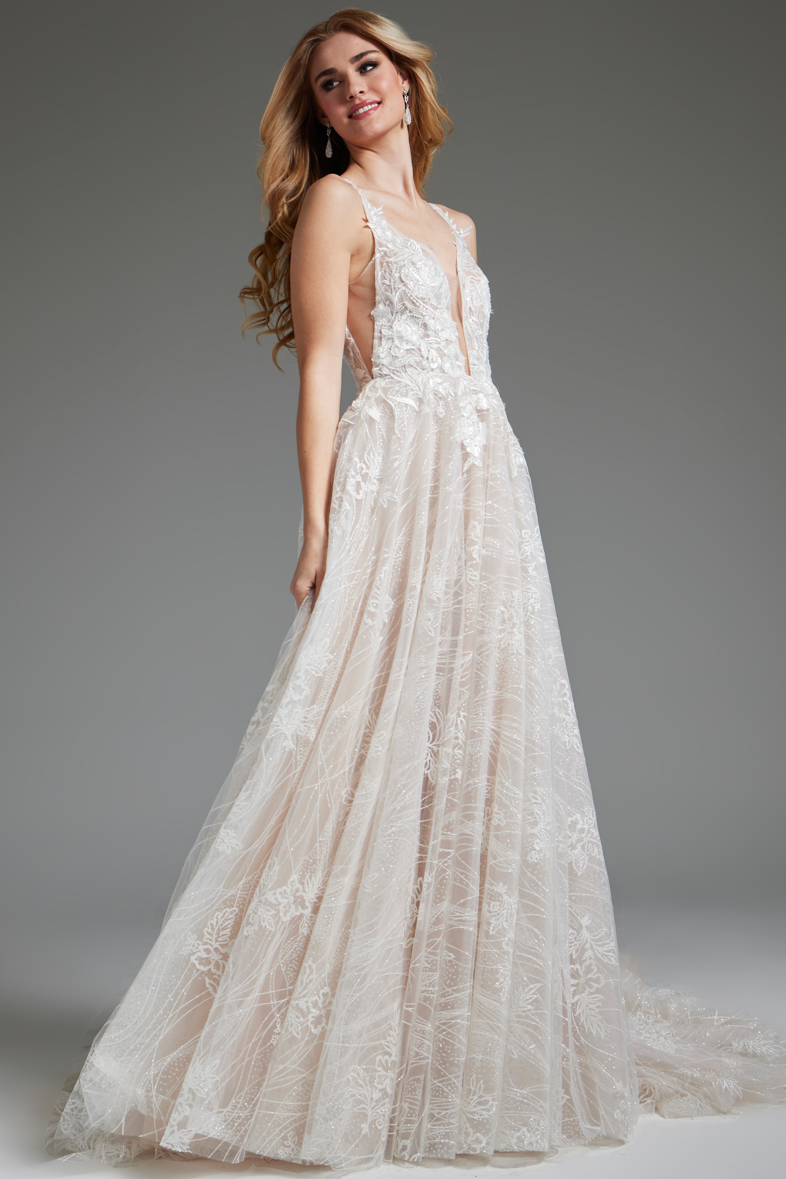 Model wearing Jovani 39435, front view emphasizing the flowing A-line skirt and lace overlay.