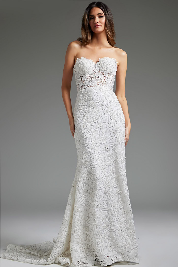 Model wearing Jovani JB39733 white gown, full-length view showcasing lace detail and silhouette.