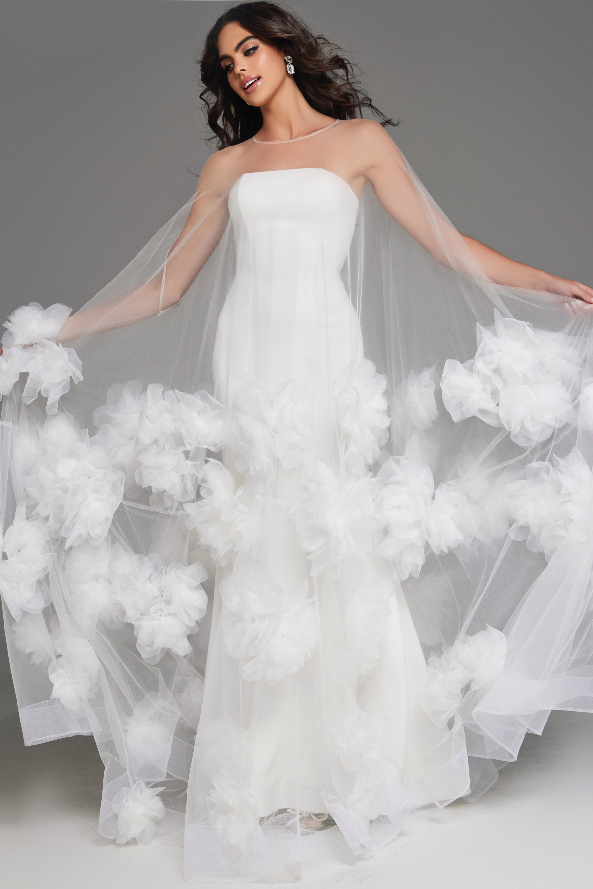 Model showing off Jovani JB40091 gown with front floral embellishments.