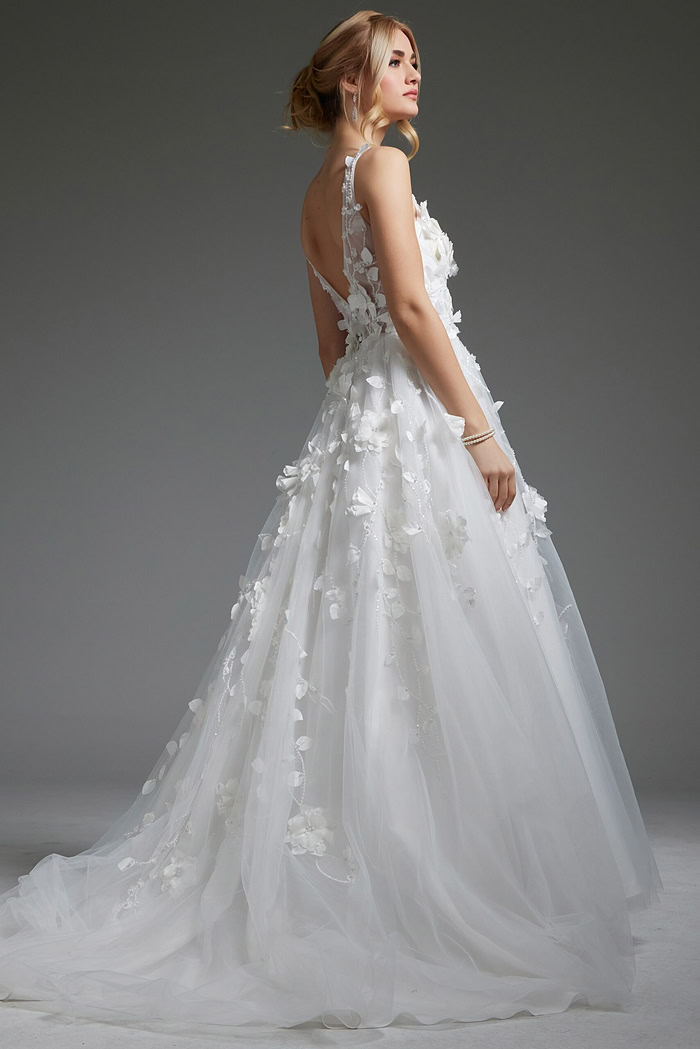 Model wearing Jovani JB40511 ivory gown, back view, highlighting the illusion back.