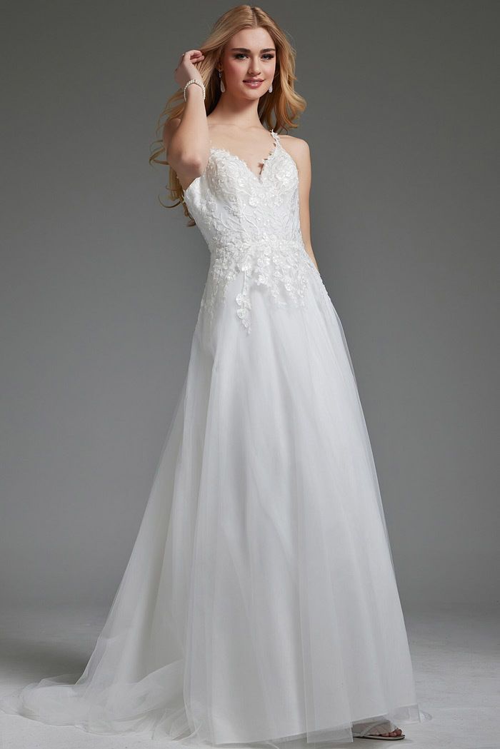 Model wearing Jovani jb40513 ivory gown with V-neckline and floral appliqués.