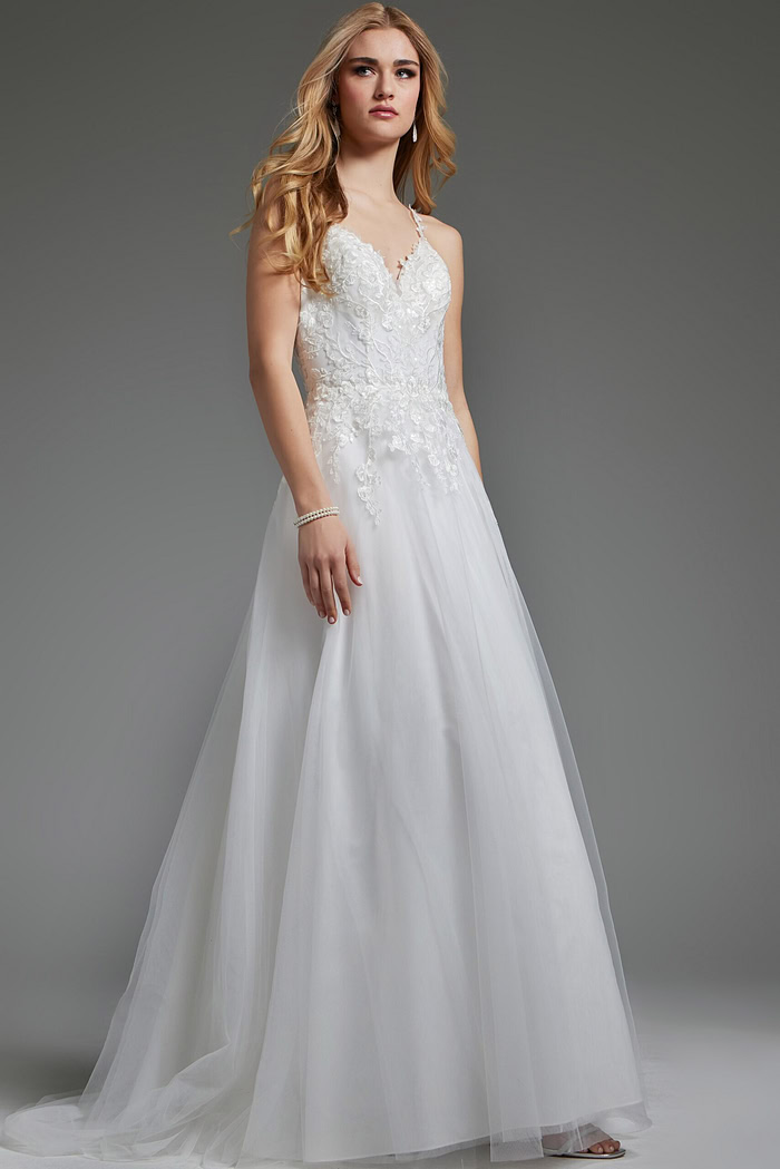 Model in Jovani jb40513 ivory dress with elegant floral lace and A-line shape.