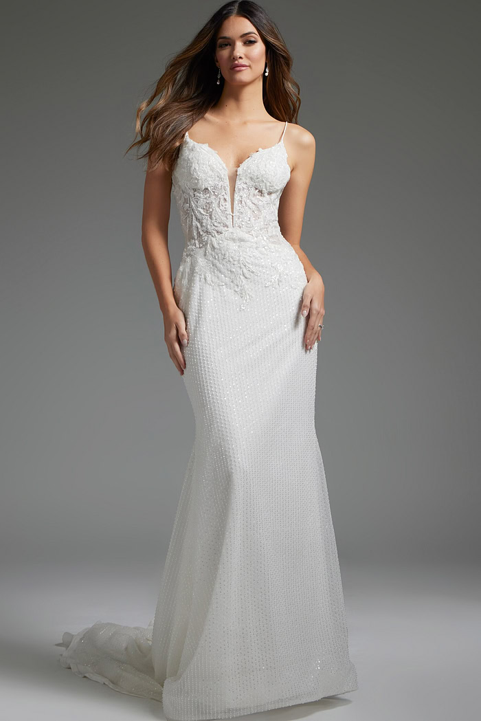 Model wearing Jovani JB40639, an elegant ivory gown with a plunging neckline and intricate lace details from the front.