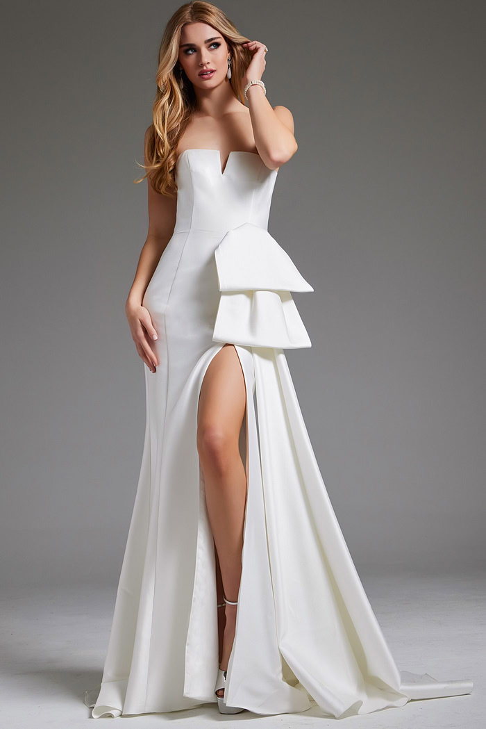 Model wearing Jovani JB40791 white strapless gown with side detail and slit.