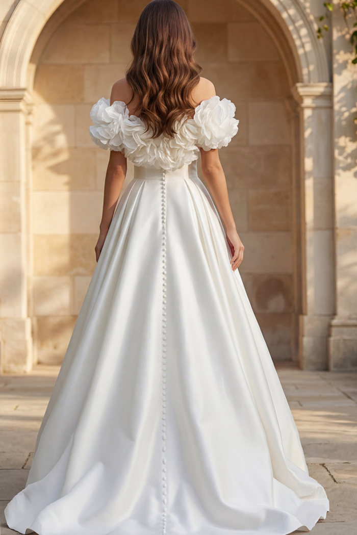 Off shoulder ball gown with oversized floral sleeves and button back detail.